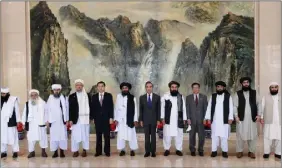  ??  ?? Chinese officials pose with the Taliban delegation during the latter’s visit to Tianjin, China on 28 July 2021.