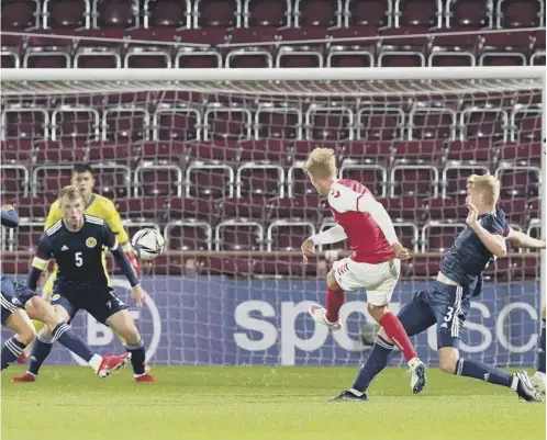  ?? ?? 0 Denmark’s Gustav Isaksen scores the only goal of the game during last night’s European Championsh­ip qualifier at Tynecastle