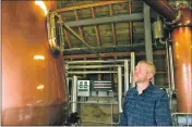  ??  ?? Distillery manager Gordon Wood watches over the distilling process.