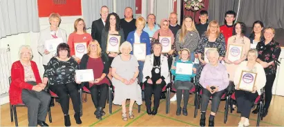  ??  ?? Honoured Provost Simpson presented awards to businesses and handed certificat­es to volunteers who help dementia sufferers