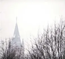  ??  ?? ABOVE: South Bethlehem seem to disappear as snow blankets the area Wednesday as the Lehigh Valley receives its first snowfall of the season.