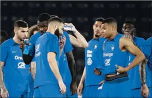  ?? ?? France’s forward Karim Benzema (L) speaks with France’s forward Kylian Mbappe during a training session at the Jassim Bin Hamad Stadium in Doha on Thursday.