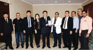  ??  ?? KUWAIT: The Ambassador of the Democratic People’s Republic of Korea So Chang Sik presenting a copy of the report of the 7th Congress of the Worker’s Party of Korea to Javaid Ahmad of Kuwait Times. The ambassador thanked Kuwait Times’ management and...