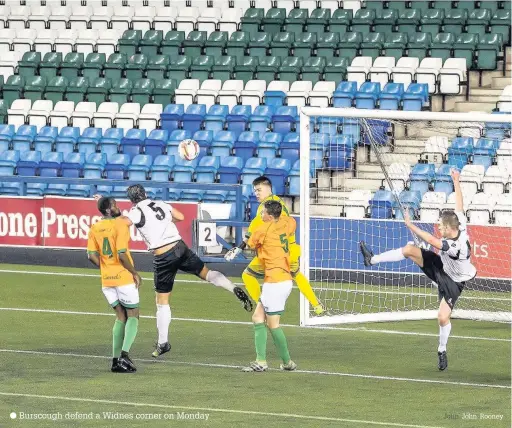  ?? Burscough defend a Widnes corner on Monday John John Rooney ??