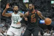  ?? RON SCHWANE — THE ASSOCIATED PRESS ?? Cleveland Cavaliers’ LeBron James (23) drives against Boston Celtics’ Marcus Morris (13) during the first half of Game 6 of the NBA basketball Eastern Conference finals Friday in Cleveland.