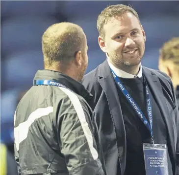  ?? ?? Sporting director Rich Hughes, centre, is relishing the task of overseeing Pompey’s ‘big summer of
