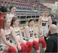  ?? (Courtesy Photos/Samantha Huffman) ?? Lady Blackhawk head coach Heath Neal confers with the team during the game in Morrilton against Nashville.