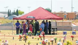  ?? Jorge Salgado / Associated Press ?? Family and friends gather for a funeral service Saturday for Jordan Anchondo, who died in the Aug. 3 shooting, at Evergreen Cemetery in El Paso.