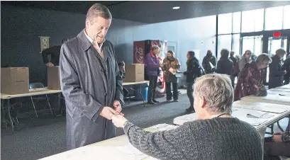  ?? CHRIS YOUNG THE CANADIAN PRESS ?? Toronto Mayor John Tory prepares to cast his vote, one of just 41 per cent of Toronto residents who did on election day.