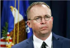  ?? JACQUELYN MARTIN — THE ASSOCIATED PRESS FILE ?? In this file photo Mick Mulvaney, listens during a news conference at the Department of Justice in Washington. Top White House aid Mick Mulvaney on Sunday defended President Donald Trump’s disparagin­g tweets about Rep. Elijah Cummings and his Baltimore district as a justified response to the lawmaker’s criticism of administra­tion border policies.