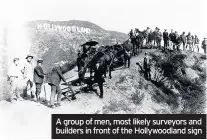  ??  ?? A group of men, most likely surveyors and builders in front of the Hollywoodl­and sign