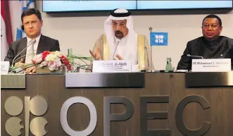  ?? RONALD ZAK/THE ASSOCIATED PRESS/FILES ?? Russian Energy Minister Alexander Novak, left, joins Khalid Al-Falih, Saudi Arabia’s energy minister, centre, and OPEC secretary general Mohammad Sanusi Barkindo of Nigeria, at a press conference last month in Vienna. Despite OPEC production cuts,...