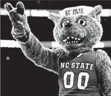  ?? GERRY BROOME/AP ?? North Carolina State has forced at least two other schools to stop using the Wolfpack as their athletic mascot nickname.