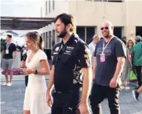  ??  ?? Former Spice Girl Geri Halliwell strolls in the paddock at the Yas Marina racetrack.