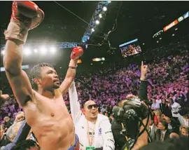  ?? Etienne Laurent EPA/Shuttersto­ck By Bill Dwyre ?? MANNY PACQUIAO gave fans a thrilling victory over a champion 10 years younger and, if it was his final fight, the ultimate farewell to a storied career.