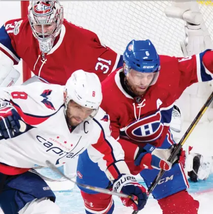  ?? PAUL CHIASSON/THE CANADIAN PRESS FILE ?? Canadiens defenceman Shea Weber is still a force of intelligen­ce and physicalit­y against the NHL’s best players, such as the Capitals’ Alex Ovechkin. It doesn’t hurt that he also has the hardest shot in the NHL.