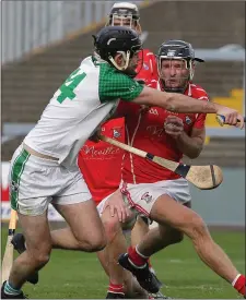  ??  ?? Kevin Rowe of Fethard winces as Shane Murphy challenges.