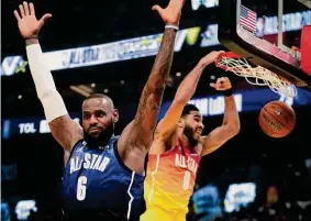  ?? Rick Bowmer/Associated Press ?? Jayson Tatum dunks over LeBron James for two of his All-Star Game-record 55 points en route to claiming MVP honors Sunday night in Salt Lake City.