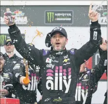  ?? ASSOCIATED PRESS FILE PHOTO ?? Jimmie Johnson celebrates in Victory
Lane after winning the NASCAR Clash in February at Daytona Internatio­nal Speedway in Daytona Beach, Fla.