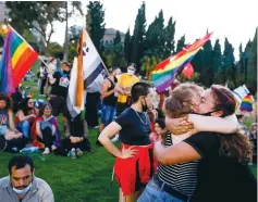  ?? (Olivier Fitoussi/Flash90) ?? PEOPLE TAKE PART in a rally to mark the annual gay pride parade in Jerusalem on Sunday.