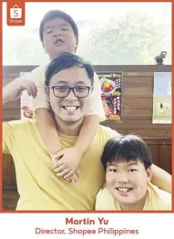  ?? ?? As a father of two young boys and a director for Shopee Philippine­s, Martin (center) constantly evolves to meet the needs of his family and consumers