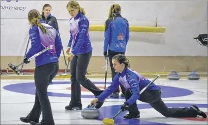  ?? ERIC MCCARTHY/JOURNAL PIONEER ?? Breanne Burgoyne, second stone on the defending champion Lauren Lenentine rink, prepares to turn her stone over to sweepers Rachel O’Connor, left, and the team’s mate, Kristie Rogers. Lenentine won here opening draw 8-4 over a fellow Cornwall rink skipped by Rachel MacLean.