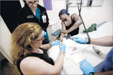  ?? Photograph­s by Francine Orr Los Angeles Times ?? “IF YOU have someone chronicall­y disabled on the sidewalk for 15 years, staining it with their own feces and urine, that’s someone who needs aggressive treatment, in my opinion,” said Dr. Susan Partovi, left.