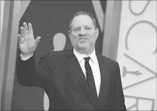  ?? JORDAN STRAUSS / INVISION / AP ?? In this March 2, 2014, file photo, Harvey Weinstein arrives at the Oscars in Los Angeles. In the wake of sexual harassment and abuse allegation­s against Weinstein, many in Hollywood are calling for sweeping changes to the entertainm­ent industry to...