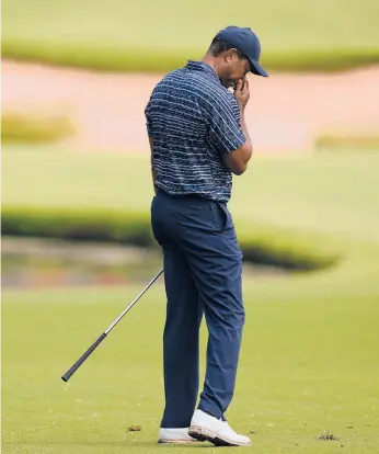  ?? ERIC GAY/AP ?? Tiger Woods shot a 4-over 74 in the opening round of the PGA Championsh­ip at Southern Hills on Thursday.