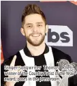  ??  ?? Singer-songwriter Thomas Rhett, winner of the Country Artist of the Year award, poses in the press room.