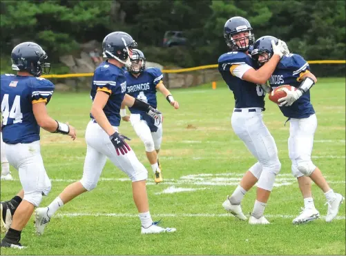  ?? Photos by Ernest A. Brown ?? Burrillvil­le junior wide receiver Aidan Tupper (below) scored a pair of first-half touchdowns, while Marcus Audet (top right) also added a pair of touchdowns in the Broncos’ 49-23 victory over Division I South Kingstown Saturday morning at Alumni Field.