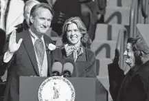  ?? Julio Cortez / Associated Press ?? Gov. Glenn Youngkin is joined by his wife Suzanne as he takes the oath of office Saturday in Richmond, Va.