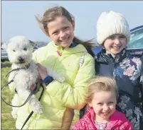  ?? (Pic: John Ahern) ?? Sisters, Emma, Aoife and Laura Mannix from Fermoy who brought their dog, Max, to last Saturday’s Kilworth & Araglin point-to-points.