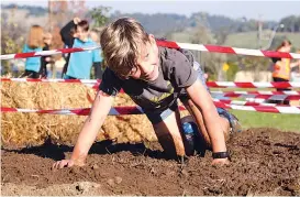  ??  ?? Above and below: Tynan Pakan powered through the Tough Mudder course to finish third.