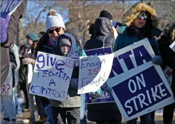  ?? NANCY LANE — BOSTON HERALD ?? Striking Newton teachers picket outside City Hall, Sunday.