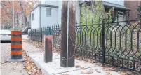  ?? JACK LAKEY ?? Toronto Hydro chopped down a concrete utility pole on Hazel Ave. and put up a replacemen­t in the middle off the sidewalk.