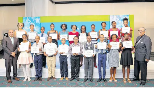  ?? CONTRIBUTE­D ?? The 2019 cohort of Sagicor Foundation Secondary scholarshi­p recipients take a photograph with Christophe­r Zacca (left), president & CEO, Sagicor Group Jamaica, and R. Danny Williams, chairman of the Sagicor Foundation, at the awards ceremony held at The Jamaica Pegasus hotel.