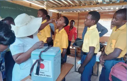  ?? ?? Students at a school in Mutare Rural district receiving the cholera vaccine recently