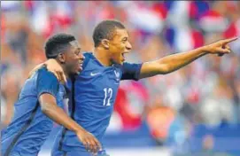  ?? AFP ?? Ousmane Dembele (left) scored the winner in 10man France’s win over England in Paris.