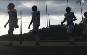  ?? Washington Post photo by Jonathan Newton ?? The storm clouds over Greenbelt, Md., clear as the Wise High Pumas take the field to take on Eleanor Roosevelt in a 2019 game.