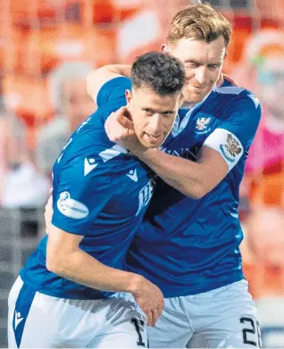  ??  ?? Guy Melamed with the Betfred Cup, top, and being congratula­ted by Saints team-mate Liam Craig after scoring against Dundee United at Tannadice.