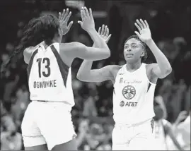  ?? Marcio Jose Sanchez Associated Press ?? SPARKS TEAMMATES and sisters, Chiney, left, and Nneka Ogwumike both spoke about what Kobe Bryant meant to women’s basketball.