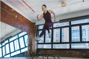  ?? ANGELO SILVIO/THE NEW YORK TIMES 2022 ?? Colette Dong of The Ness bouncing studio works out on a trampoline in New York.