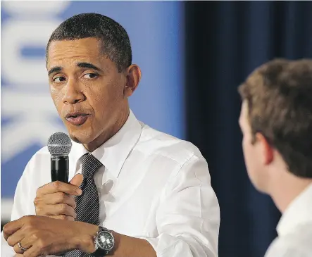  ?? JUSTIN SULLIVAN / GETTY IMAGES ?? Then-U. S. President Barack Obama talks with Facebook CEO Mark Zuckerberg during a town hall meeting at Facebook headquarte­rs in April 2011 in Palo Alto, Calif. Obama met with Zuckerberg last year to warn of the dangers of Facebook being used to spread...