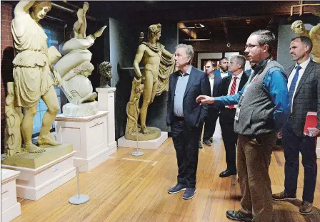  ?? PHOTOS BY DANA JENSEN/THE DAY ?? Gov. Ned Lamont tours the Slater Memorial Museum with museum Director Dayne Rugh on Wednesday at Norwich Free Academy.