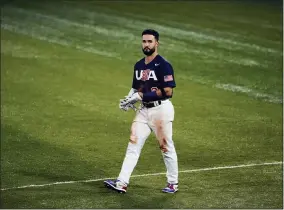  ?? JAE C. HONG - THE ASSOCIATED PRESS ?? United States’ Eddy Alvarez walks to the dugout after grounding out in the fifth inning of the gold medal baseball game against Japan at the 2020Summer Olympics, Saturday, Aug. 7, 2021, in Yokohama, Japan.