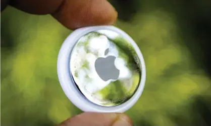  ??  ?? An Apple AirTag, which is designed to track and find personal belongings by ‘pinging’ nearby Bluetooth devices. Photograph: Jim Lo Scalzo/EPA