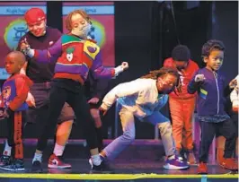  ?? K.C. ALFRED U-T ?? Children take to the stage to dance during the annual Kwanzaa Celebratio­n held at the WorldBeat Cultural Center in Balboa Park on Dec. 26, 2021.