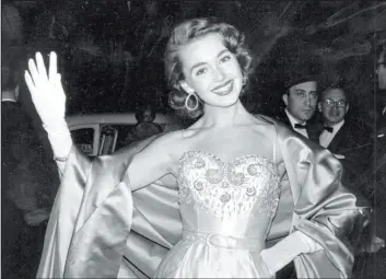  ?? Robert Kradin The Associated Press ?? Actor Barbara Rush poses at the premiere of “The Magnificen­t Obsession” in 1954. Rush co-starred in films with Frank Sinatra and Paul Newman.