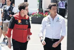  ?? REUTERS ?? Ferrari chief Mattia Binotto, left, and Mercedes boss Toto Wolff.